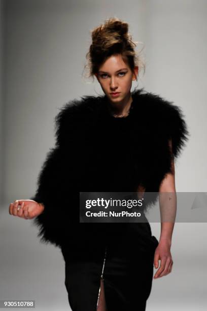 Model presents a Fall/Winter 2018-2019 collection creation by Portuguese fashion Designer David Ferreira during the 50th edition of Moda Lisboa...