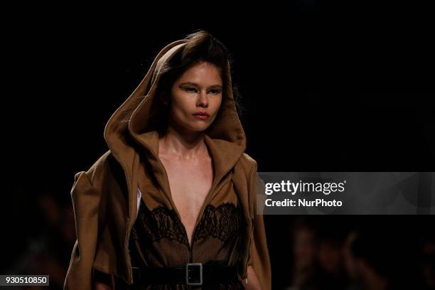 Model presents a Fall/Winter 2018-2019 collection creation by Portuguese fashion Designer David Ferreira during the 50th edition of Moda Lisboa...