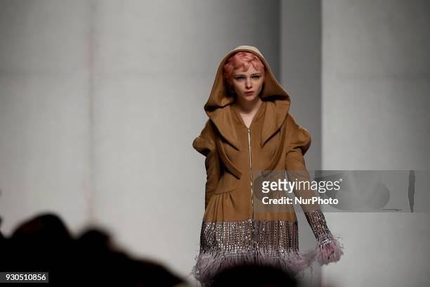 Model presents a Fall/Winter 2018-2019 collection creation by Portuguese fashion Designer David Ferreira during the 50th edition of Moda Lisboa...