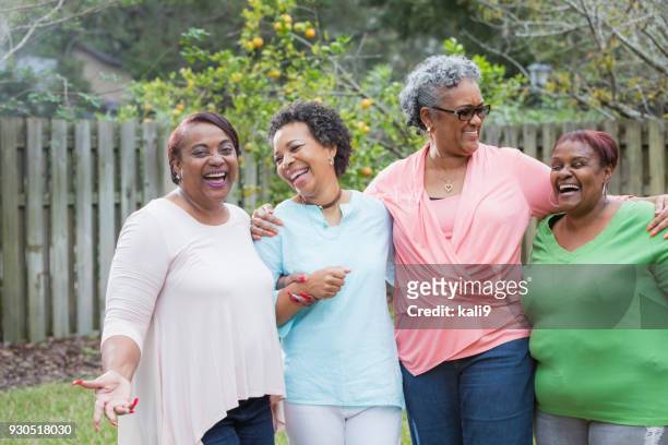 four african-american women standing outdoors together - black family reunion stock pictures, royalty-free photos & images