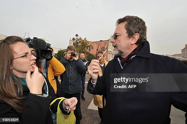 An expert of the Worcester Polytechnic Institute stands near a man taking saliva swab for a research on the origins of the Ancient Venetians on...