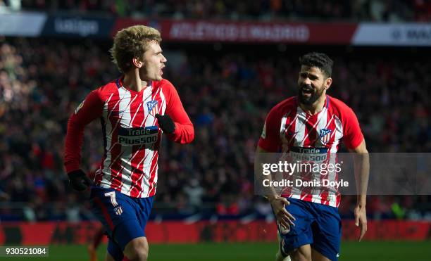 Antoine Greizmann of Atletico de Madrid celebrates with Diego Costa after scoring his team's opening goal during the La Liga match between Atletico...