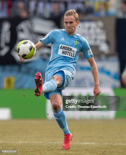 Dennis Grote of Chemnitz plays the ball during the 3. Liga match between Chemnitzer FC and Hallescher FC at community4you ARENA on March 11, 2018 in...