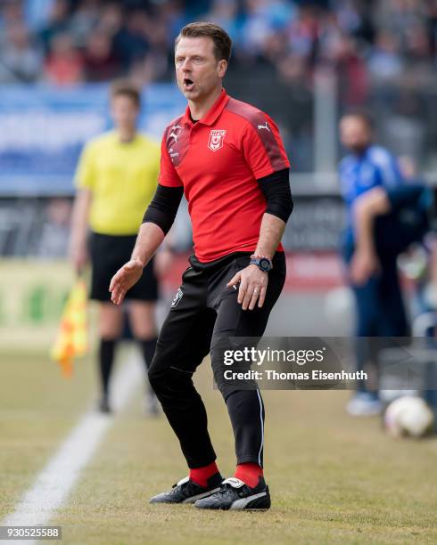 Coach Rico Schmitt of Halle reacts during the 3. Liga match between Chemnitzer FC and Hallescher FC at community4you ARENA on March 11, 2018 in...