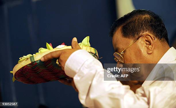 Myanmar junta leader General Than Shwe tours the ancient ruins of former royal palaces to see the historic Ruvanvelisaya Dagoba, that was part of a...