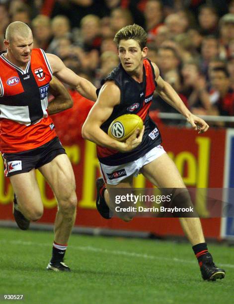Danny Jacobs for Essendon out runs Barry Hall for St.Kilda during the round 11 AFL match between the St.Kilda Saints and the Essendon Bombers, played...