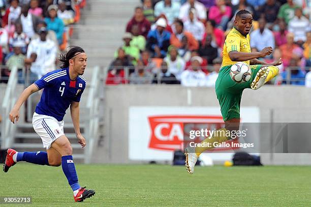 Benni McCarthy and Marcus Tulio Tanaka in action durng the International friendly match between South Africa and Japan at Nelson Mandela Bay Stadium...