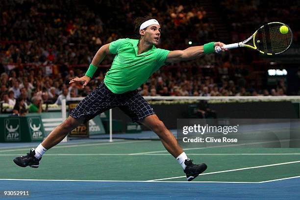 Rafael Nadal of Spain stretches for a backhand during his semi-final match against Novak Djokovic of Serbia during the ATP Masters Series at the...