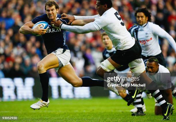 Rory Lamont of Scotland is tackled by Iferemeimi Rawaqa of Fiji during the Bank of Scotland Corporate Autumn Tests at Murrayfield Stadium on November...