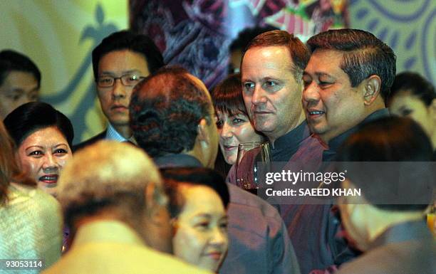 New Zealand Prime Minister John Key and Indonesian President Susilo Bambang Yudhoyono meet with other leaders at a reception prior to dinner during...