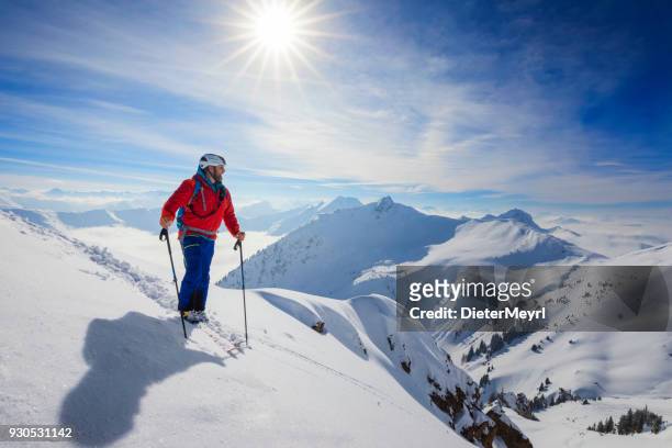 cross country skiier - ski touring in alps - professional skiers stock pictures, royalty-free photos & images