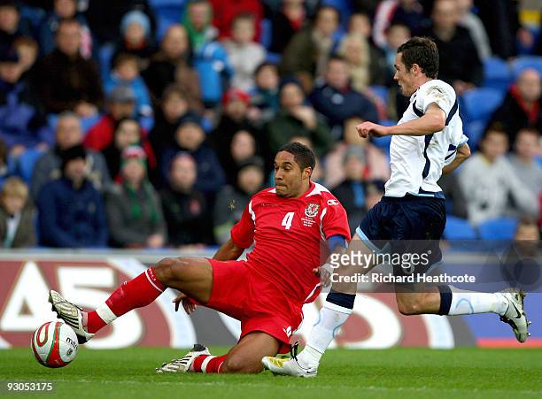 Don Cowie of Scotland is tackled by Ashley Williams of Wales during the International Friendly match between Wales and Scotland at the Cardiff City...