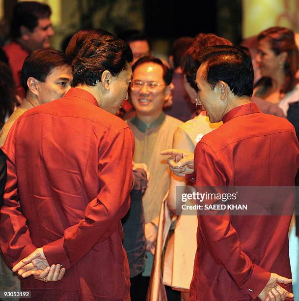 Japanese Prime Minister Yukio Hatoyama talks with South Korean President Lee Myung-Bak at a reception prior to dinner during the Asia-Pacific...