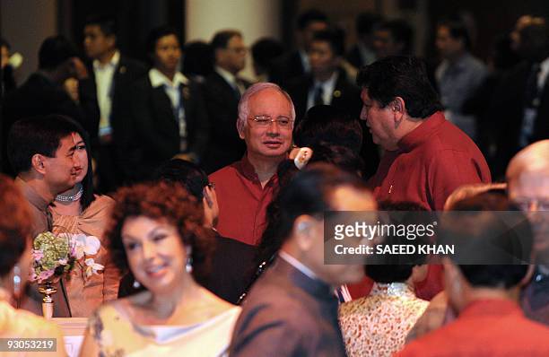 Malaysian Prime Minister Najib Razak talks with other leaders at a reception prior to dinner during the Asia-Pacific Economic Cooperation summit in...