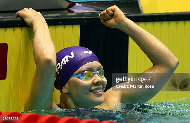 Shiho Sakai of Japan celebrates after winning the women's 200m backstroke final during day one of the FINA/ARENA Swimming World Cup on November 14,...