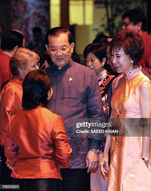 Taiwanese Former vice-president Lien Chan and his wife talk with Philippines President Gloria Arroyo at a reception prior to dinner during the...