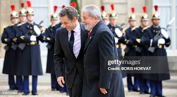 French President Nicolas Sarkozy welcomes his Brazilian counterpart Luiz Inacio Lula da Silva prior to a meeting on November 14, 2009 at the Elysee...