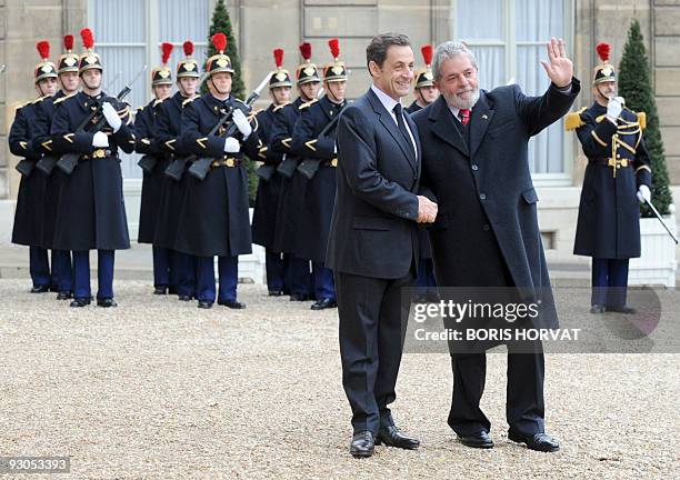 French President Nicolas Sarkozy welcomes his Brazilian counterpart Luiz Inacio Lula da Silva prior to a meeting on November 14, 2009 at the Elysee...