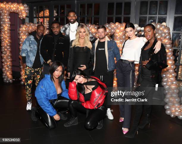 Rich Paul, Simon, Tristan Thompson, Khloe Kardashian, Lucas Newton, Kendall Jenner, Justine Skye, Jordan Woods and Kylie Jenner pose for a photo as...