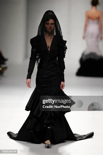 Model presents a Fall/Winter 2018-2019 collection creation by Portuguese fashion Designer David Ferreira during the 50th edition of Moda Lisboa...