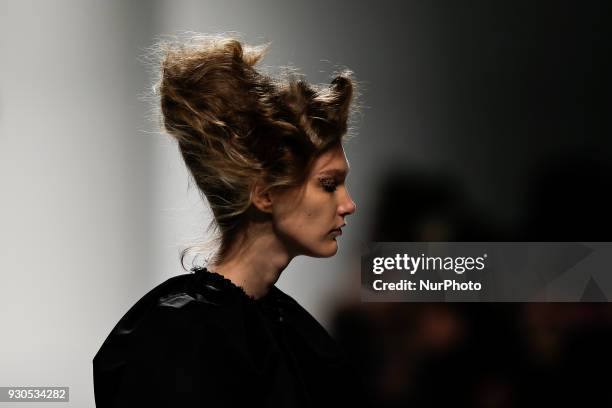 Model presents a Fall/Winter 2018-2019 collection creation by Portuguese fashion Designer David Ferreira during the 50th edition of Moda Lisboa...