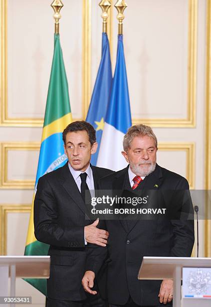 French President Nicolas Sarkozy and his Brazilian counterpart Luiz Inacio Lula da Silva give a press conference prior to a meeting on November 14,...