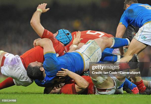 Wales James Davies feels the full weight of the ruck during the NatWest Six Nations Championship match between Wales and Italy at Principality...