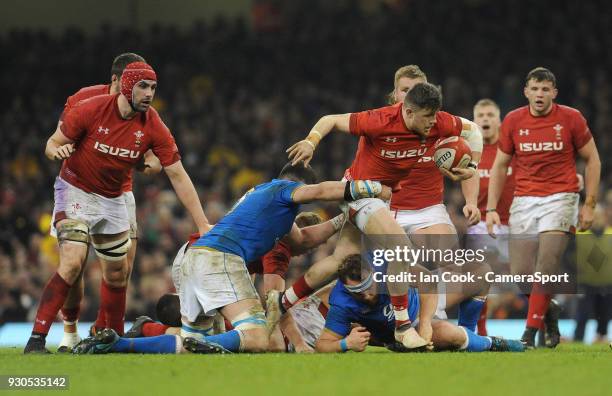 Wales Steff Evans pushes past the grasps of Italys Sebastian Negri during the NatWest Six Nations Championship match between Wales and Italy at...