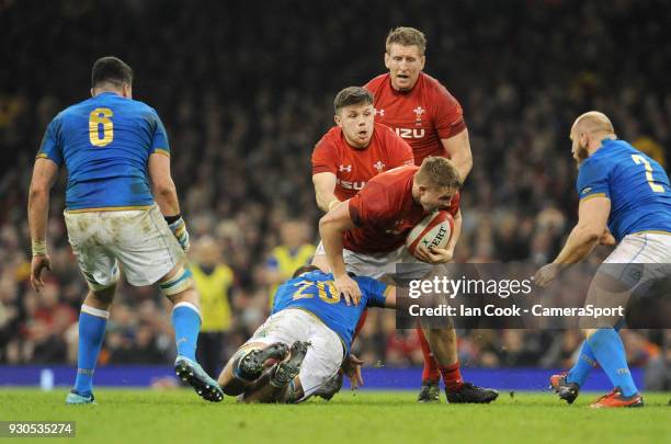 Wales James Davies is tackled by Italys Giovanni Licata during the NatWest Six Nations Championship match between Wales and Italy at Principality...