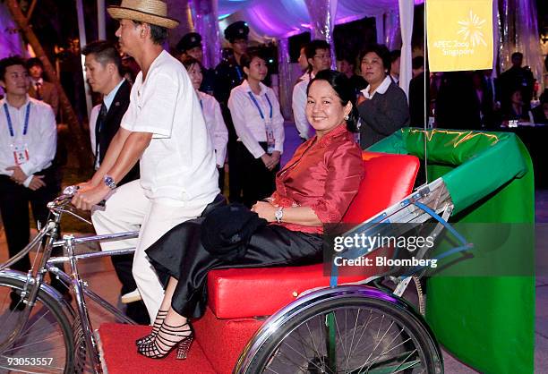 Gloria Macapagal-Arroyo, president of the Philippines, arrives for a dinner reception on the sidelines of the Asia-Pacific Economic Cooperation...