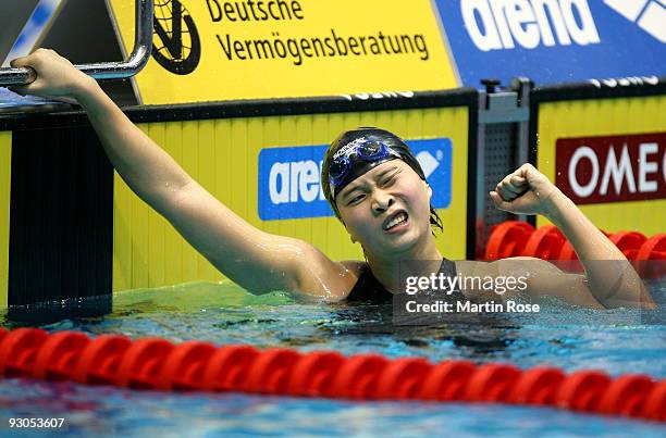 Jiaxing Li of China celebrates after winning the women's 200m individual medley final during day one of the FINA/ARENA Swimming World Cup on November...