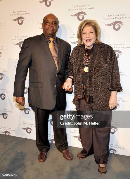 Former PGA Pro Lee Elder and Wallis Annenberg attend the opening of SPORT: Iooss & Leifer at the Annenberg Space For Photography on November 13, 2009...