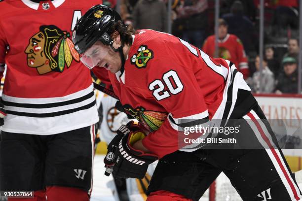 Brandon Saad of the Chicago Blackhawks skates off the ice after a hard hit by Zdeno Chara of the Boston Bruins at the United Center on March 11, 2018...