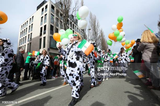 Group of cows. Around 15.000 celebrated St. Patrick's day in Munich, Germany, on 11 March 2018. There were many different groups in the parade.