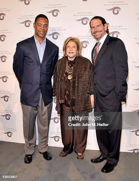 Former NFL Player Marcus Allen, Wallis Annenberg and Charlie Annenberg attend the opening of SPORT: Iooss & Leifer at the Annenberg Space For...
