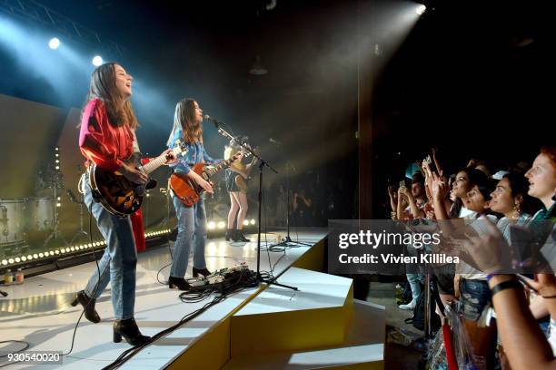 Alana Haim, Danielle Haim and Este Haim of HAIM perform onstage during Bumble Presents: Empowering Connections at Fair Market on March 10, 2018 in...