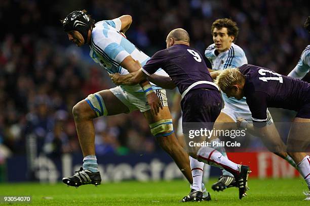 Patricio Albacete of Argentina is taken down by Paul Hodgson of England during the Investec Challenge match between England and Argentina at...