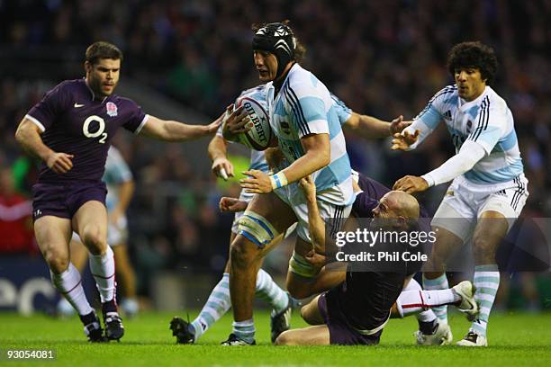 Patricio Albacete of Argentina is taken down by Paul Hodgson of England during the Investec Challenge match between England and Argentina at...