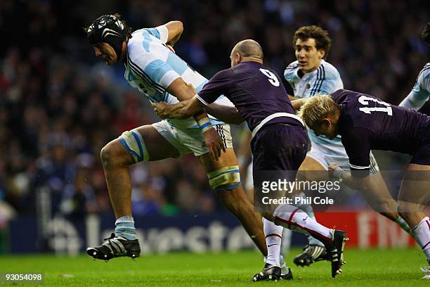 Patricio Albacete of Argentina is taken down by Paul Hodgson of England during the Investec Challenge match between England and Argentina at...
