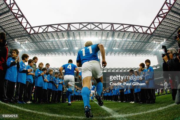 Mirco Bergamasco of Italy and his team-mates makes their way onto the pitch prior to the start of the international rugby match between Italy and New...