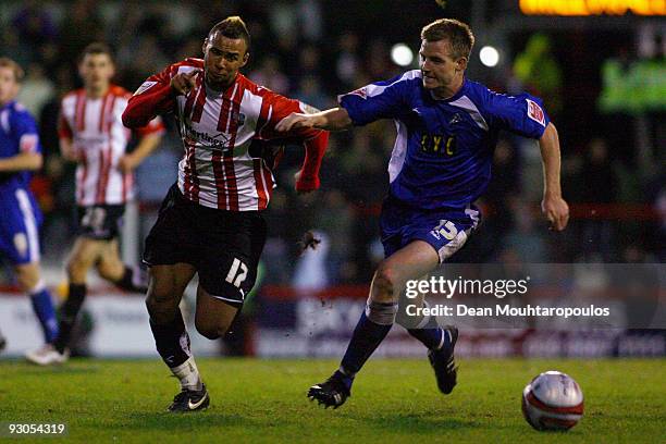 John Bostock of Brentford battles for the ball with Tony Craig of Millwall during the Coca-Cola League One match between Brentford and Millwall at...