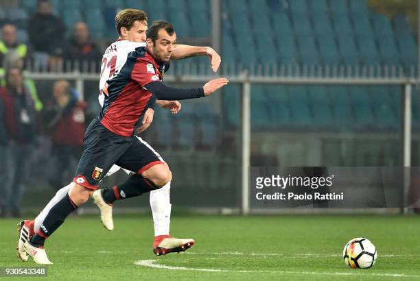 Goran Pandev of Genoa opposed to Lucas Biglia of Milan during the serie A match between Genoa CFC and AC Milan at Stadio Luigi Ferraris on March 11,...