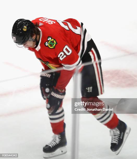 Brandon Saad of the Chicago Blackhawks leaves the ice after a high stick by Zdeno Chara of the Boston Bruins in the third period at the United Center...
