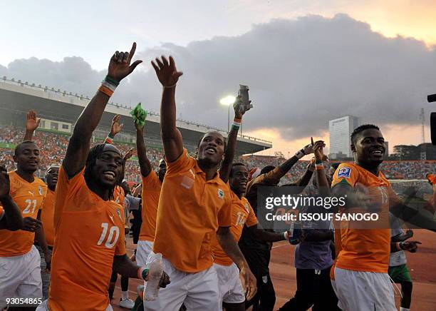 Ivory Coast's National football team players Salomon Kalou, Gervais Kouassi Yao, Didier Drogba, Kouamatine Kone and Ndri Koffi Romaric celebrate...