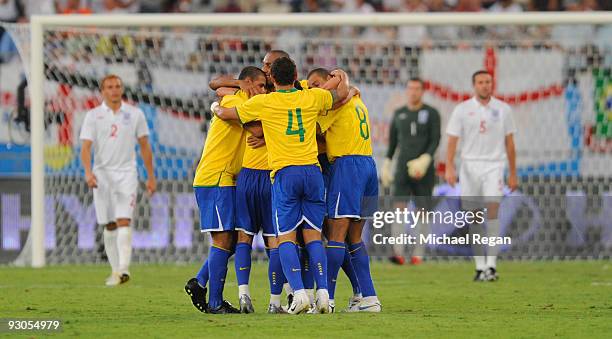 Brazil players celebrate the first goal during the International Friendly match between Brazil and England at the Khalifa Stadium on November 14,...