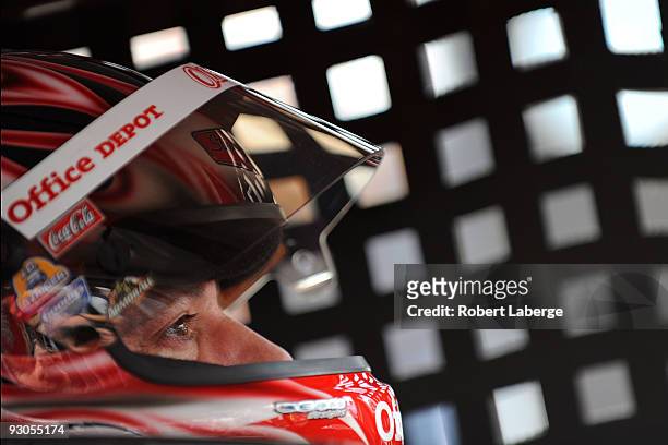 Tony Stewart driver of the Old Spice Office Depot Chevrolet sits in his car during practice for the NASCAR Sprint Cup Series Checker O'Reilly Auto...