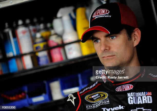 Jeff Gordon, driver of the DuPont Chevrolet, waits in the garage before practice for the NASCAR Sprint Cup Series Checker O'Reilly Auto Parts 500 at...