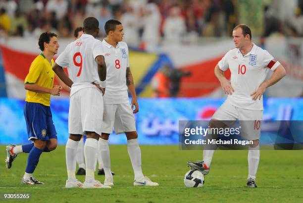 Captain Wayne Rooney, Jermaine Jenas and Darren Bent of England look dejected after Brazil's first goal during the International Friendly match...