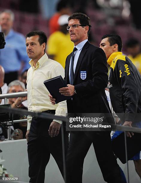 England manager Fabio Capello and Brazil manager Dunga look on during the International Friendly match between Brazil and England at the Khalifa...