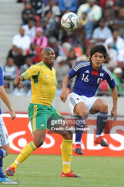 Kagisho Dikgacoi and Yoshito Okubo in action during the international match between South Africa and Japan at Nelson Mandela Bay Stadium on November...